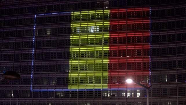 A Belgian flag made of coloured lights appears on the Berleymont European building in Brussels