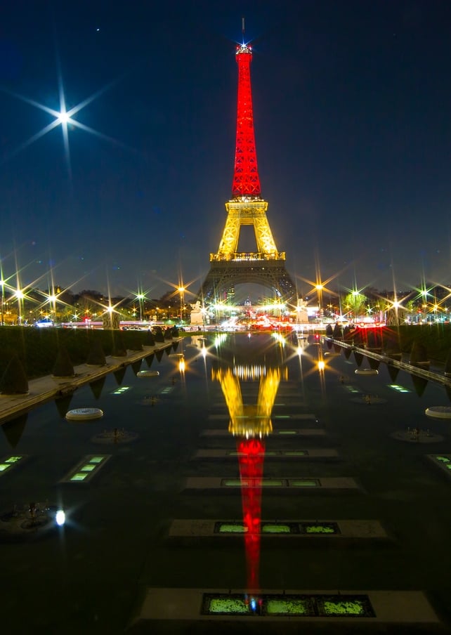 The Eiffel Tower is illuminated in the national colours of Belgium in tribute to the victims of the attacks in Belgium