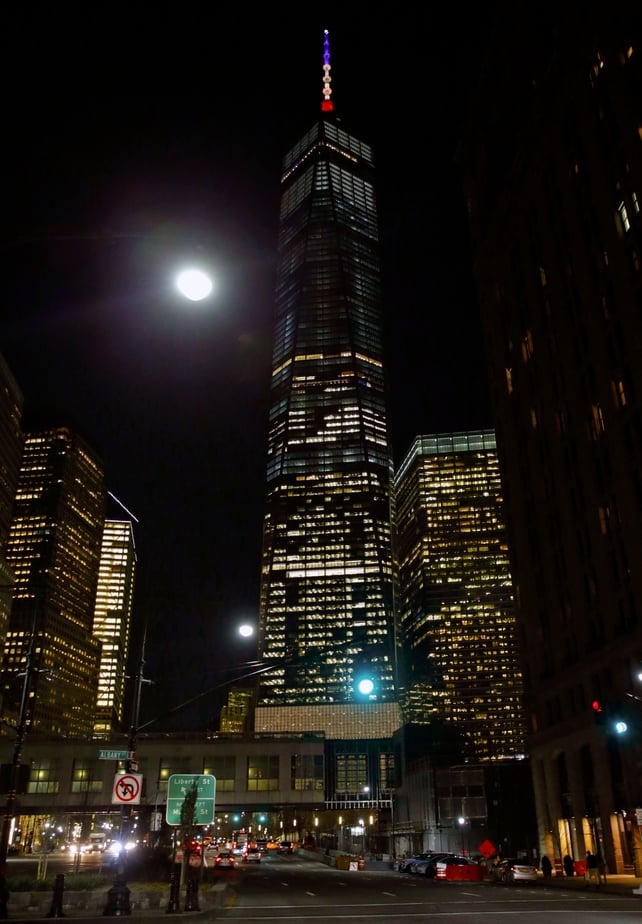 The spire of One World Trade center is illuminated in the colors of the French national flag, in New York - a tribute that has caused some confusion as the monument was not lit in Belgium's national colours