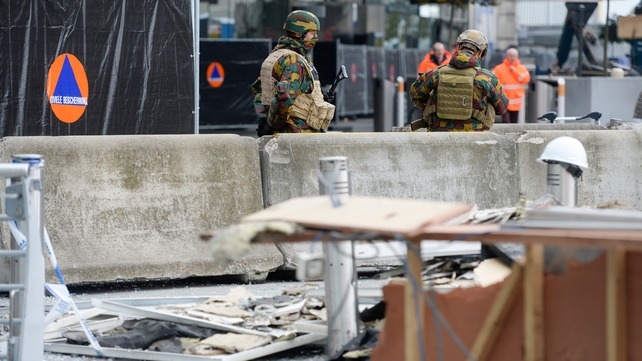 Soldiers are pictured at the scene outside the airport