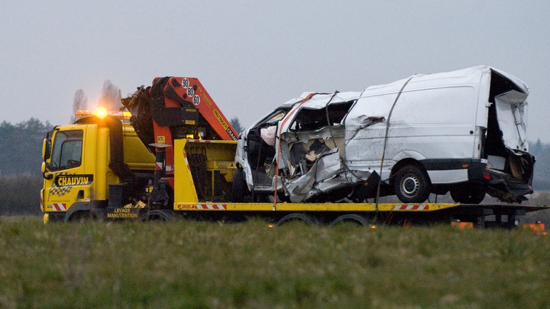 The wreckage of the minibus is taken from the scene