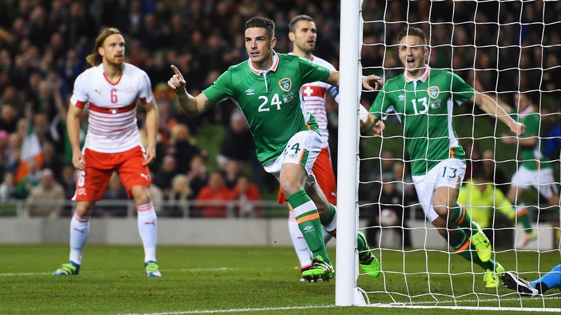 Ciaran Clark wheels away to celebrate his early goal against Switzerland