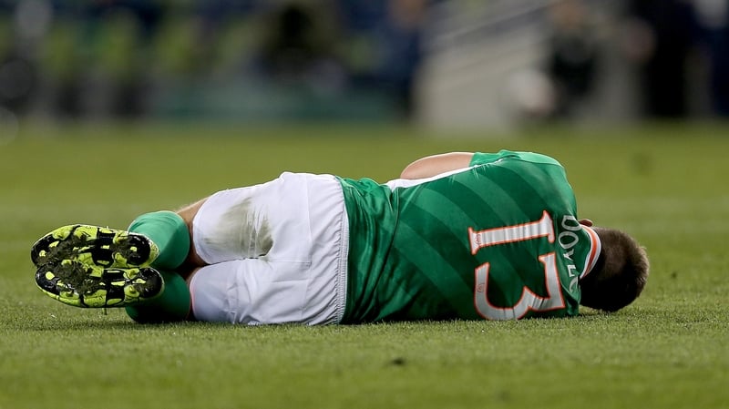 Ireland's Kevin Doyle lies injured after suffering a leg injury against Switzerland