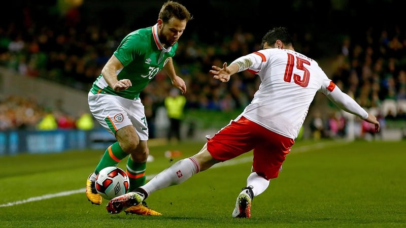 Ireland's Alan Judge is tackled by Blerim Dzemaili of Switzerland