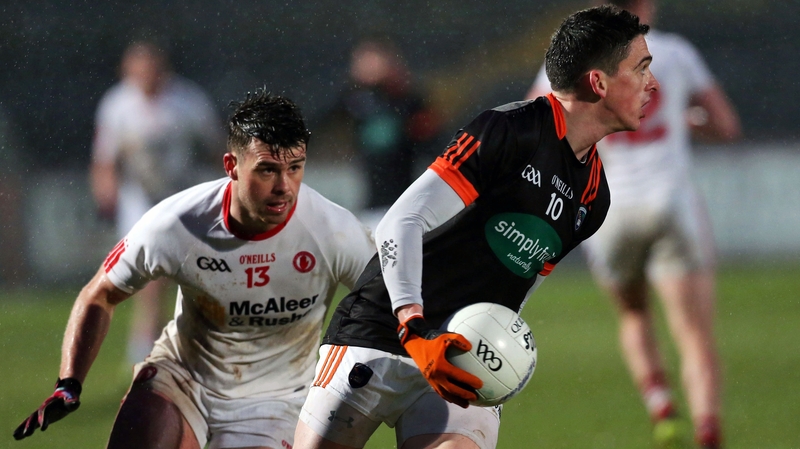 Tyrone's Darren McCurry puts Armagh's Rory Grugan under pressure