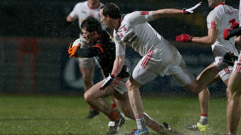 Tyrone's Colm Cavanagh chases down Miceal McKenna of Armagh