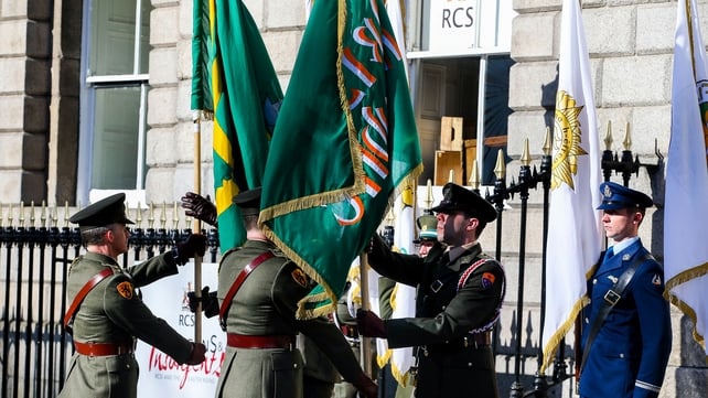 Two flags - the Irish Republic Flag and the Starry Plough - are handed over at a flag ceremony at the RCSI