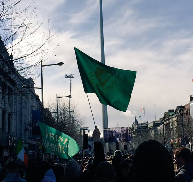 Crowds watching the parade make its way across the city on a large screen on O'Connell Street