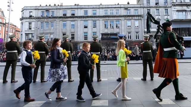 Children representing the four provinces laid bouquets of daffodils at the GPO