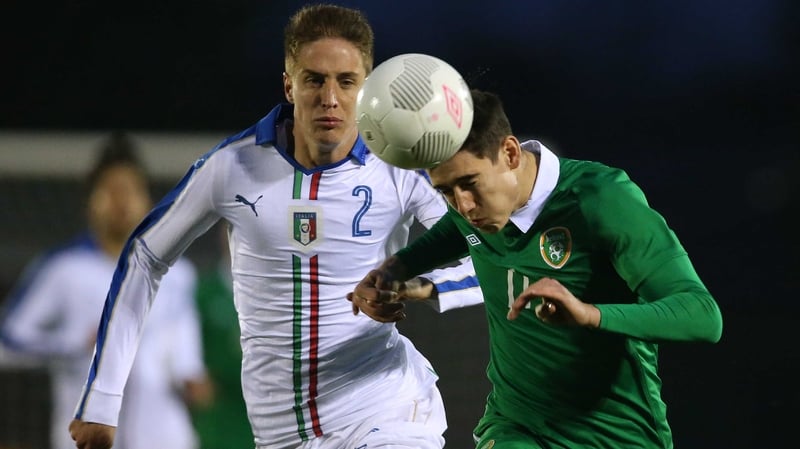 Republic of Ireland's Callum O’Dowda nods away from Andrea Conti of Italy