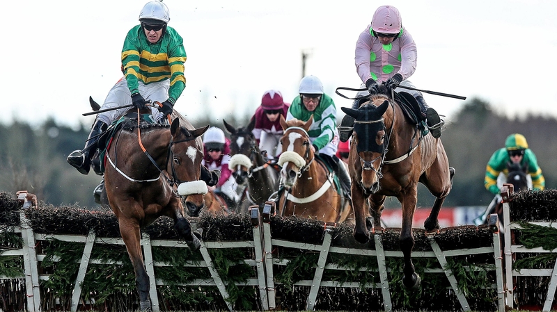 Barry Geraghty on Sutton Place (L) and Ruby Walsh on Royal Caviar jump the last fence together
