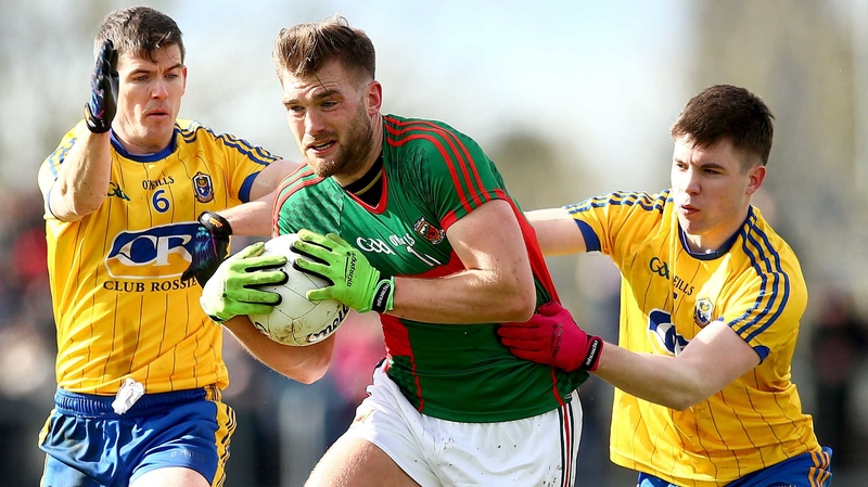 Aidan O'Shea (C) is accosted by Roscommon’s Conor Daly and Sean Purcell