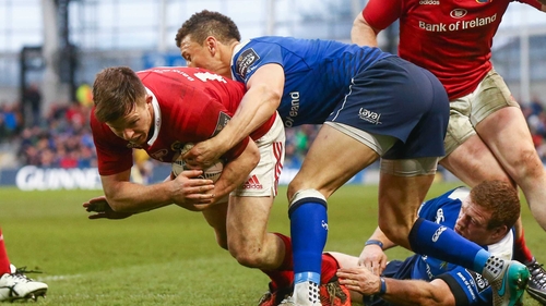 Johnny Holland goes into the corner for Munster's try