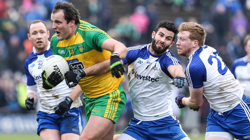 Michael Murphy of Donegal and Neil McAdam of Monaghan scrap for possession