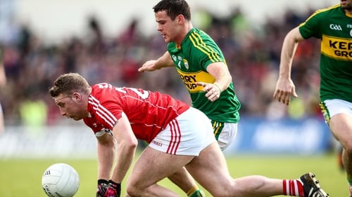 Kerry's Shane Enright tackles Brian Hurley of Cork