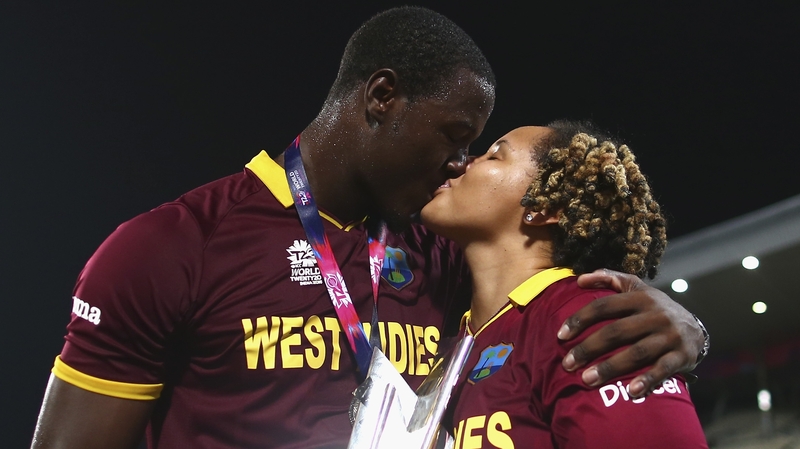 Carlos Brathwaite and his partner celebrate a famous victory