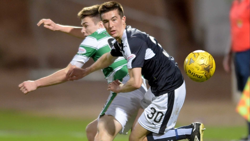 Dundee's Cameron Kerr beat's Celtic'S Kieran Tierney to the ball
