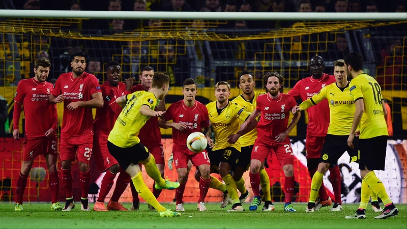 Marco Reus shoots a free kick towards the wall