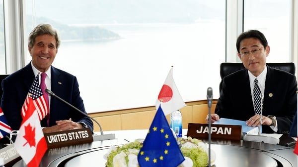 John Kerry and Japanese Foreign Minister Fumio Kishida pose during the first session of the G7 Foreign Ministers' meeting