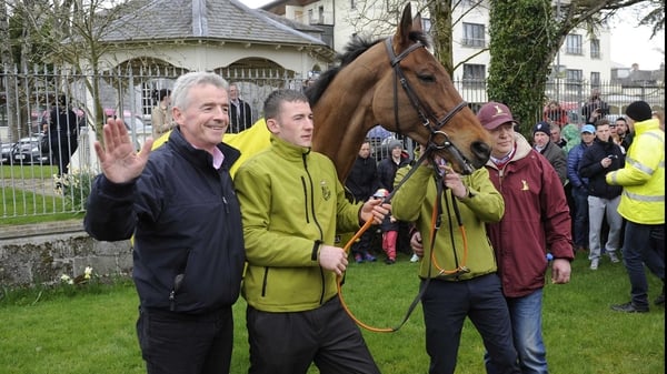 Rule The World vindicated his trainer's lofty opinion of him with victory in the world's most famous steeplechase