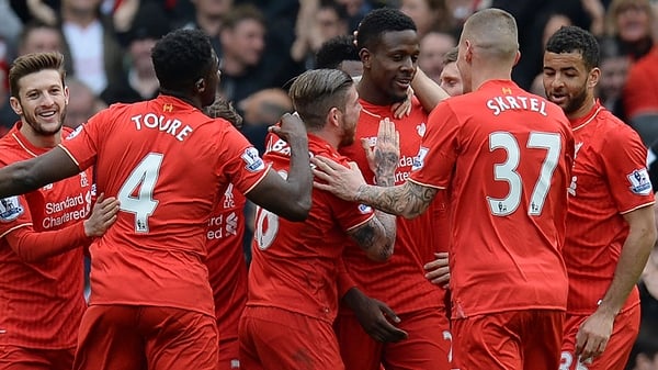 Divock Origi (4R) celebrates scoring his team's fourth goal