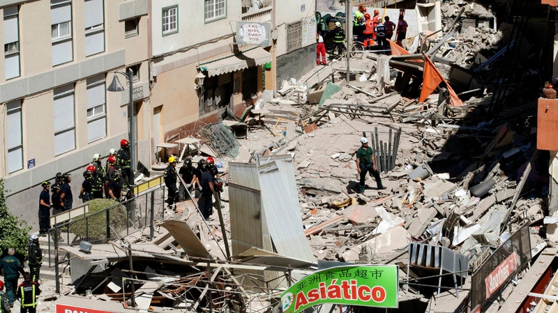 Rescue workers at the scene of the building collapse