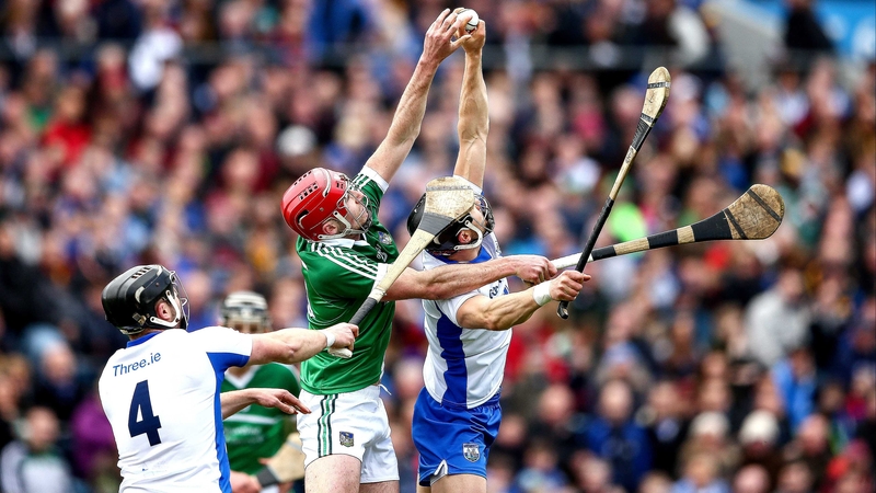 Limerick's Barry Nash with Noel Connors and Darragh Fives of Waterford contest high ball