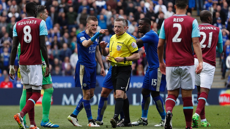 Jamie Vardy has a word with the ref after being sent off