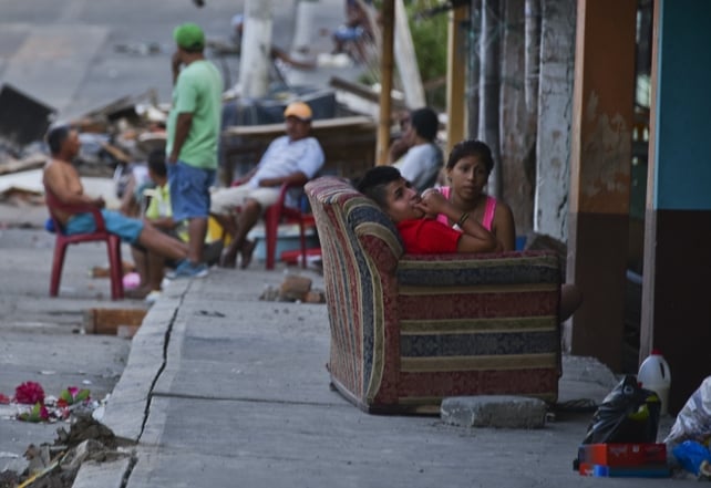 People rest on the streets of Manta