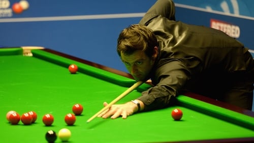 Ronnie O'Sullivan plays a shot against David Gilbert during their first round match of the 2016 Betfred World Snooker Championship