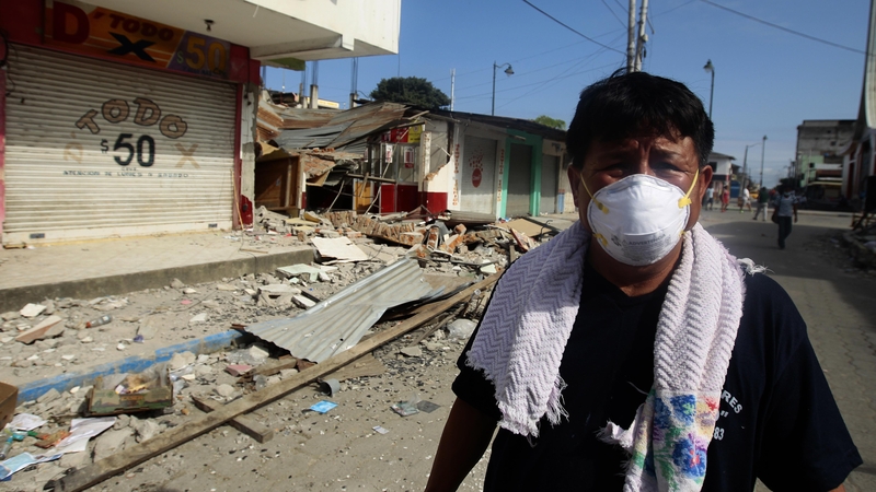 A resident of Pedernales wears a mask following the earthquake