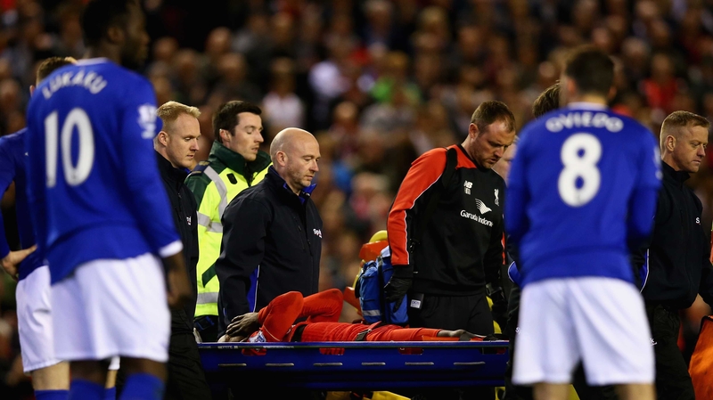 Divock Origi is carried off on a stretcher