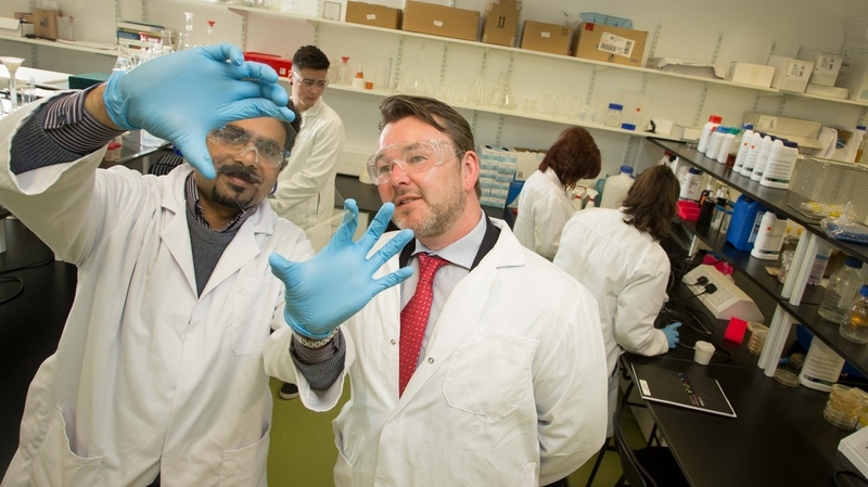 Professor Suresh Pillai (r) from Sligo IT and John Browne of Kastus Technologies view the anti-superbug solution on glass