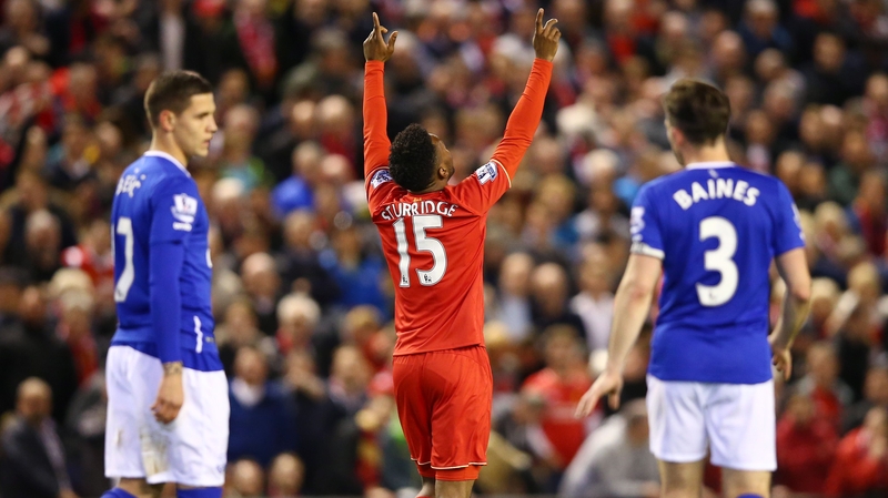 Daniel Sturridge celebrates scoring his side's third goal against Everton