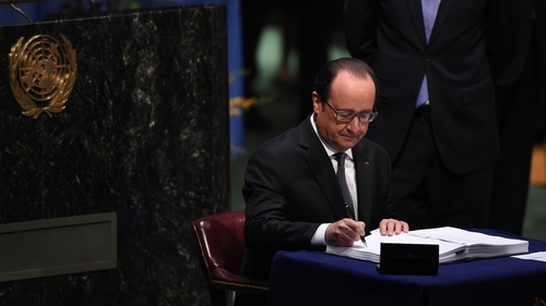 Francois Hollande was the first of scores of leaders to sign the deal