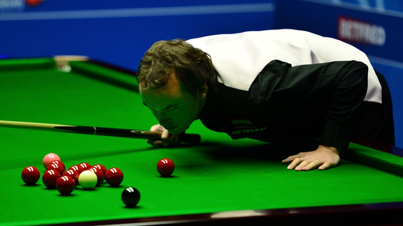 Sam Baird lines up a shot during his second-round match against Mark Selby