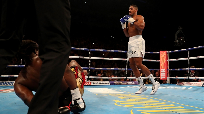 Anthony Joshua looks on after flooring Charles Martin