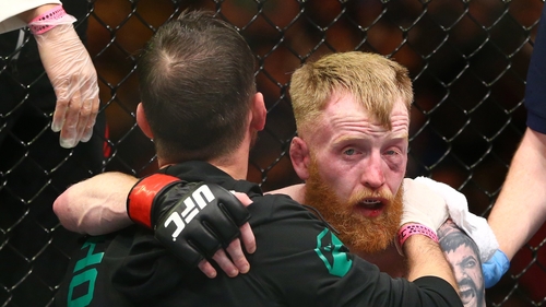 A dejected Paddy Holohan with coach john Kavanagh after losinig to Louis Smolka in October 2015