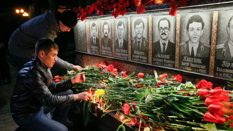 A candle-lit vigil at a ceremony in Slavutich city