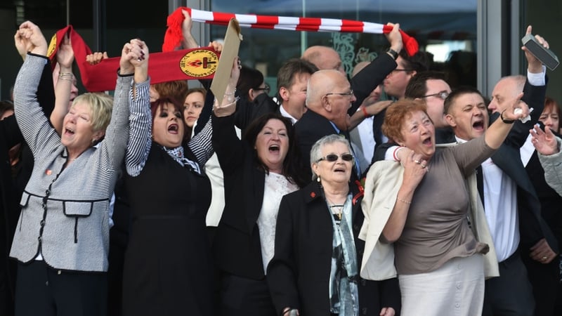 Relatives of those who died sing 'You'll never walk alone' following the inquest