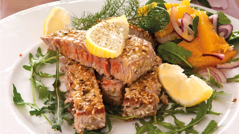 Sesame crusted tuna with chilli mayo and spinach orange salad.