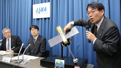 Takashi Kubota, JAXA space program director, announces the decision