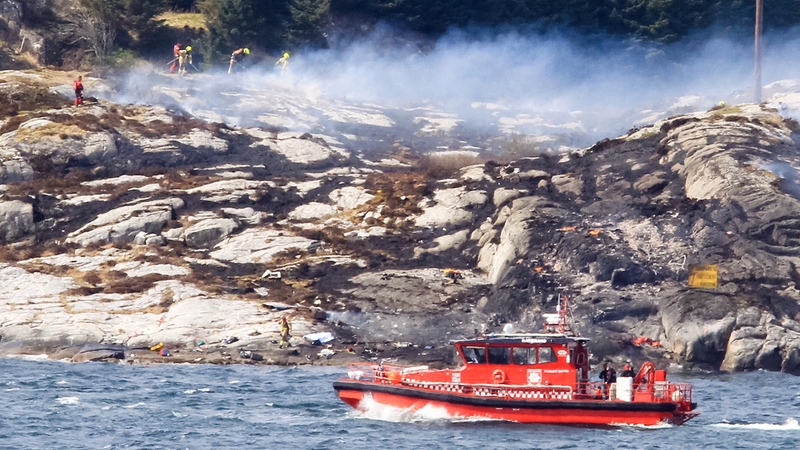 Rescue personnel at land and water search near the site of the crash