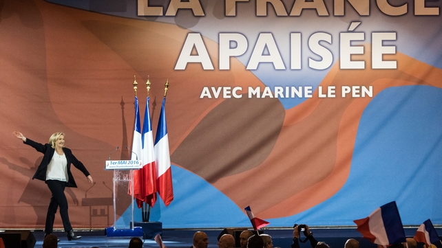 French National Front leader Marine Le Pen arrives to deliver a speech during the party's traditional Joan of Arc May Day rally in Paris