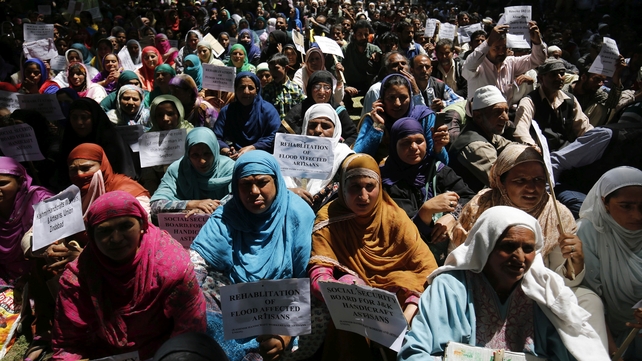 Women attend a protest rally marking Labour Day in Srinagar, Kashmir