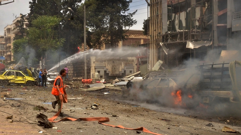 The smouldering facade of the Al-Dabbeet hospital in Aleppo which was destroyed yesterday