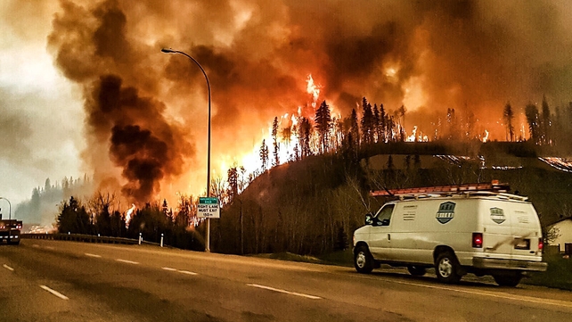 Flames are seen rising into the sky over Fort McMurray (Pic: @jeromegarot)