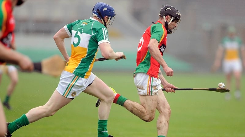 Carlow’s Diarmuid Byrne with Dermot Mooney of Offaly