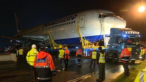 The Boeing 767 was transported by truck and trailer from the beach to the campsite