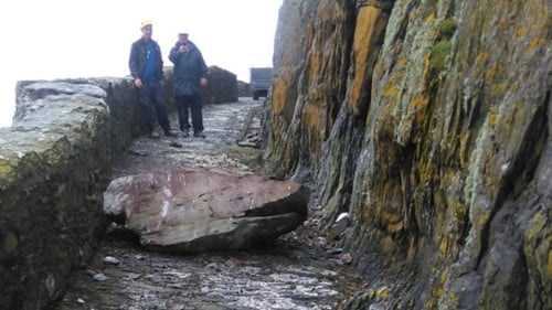 As a result of the size of the boulder the road is effectively blocked until it can be dealt with